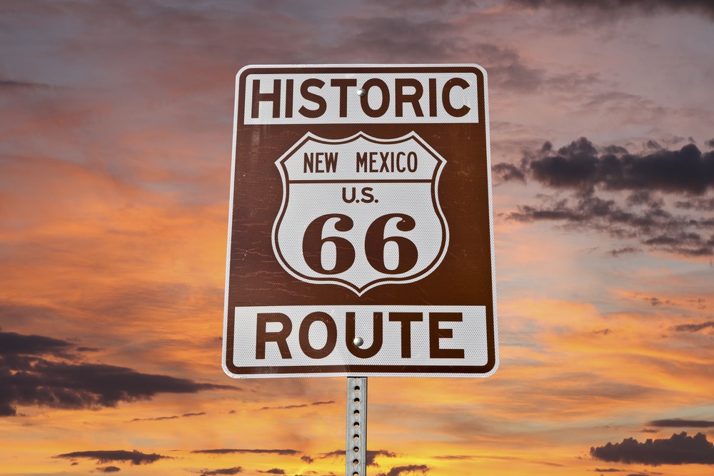 Historic Route 66 Road Marker with sunset in background. Visit the Route 66 Centennial this year.